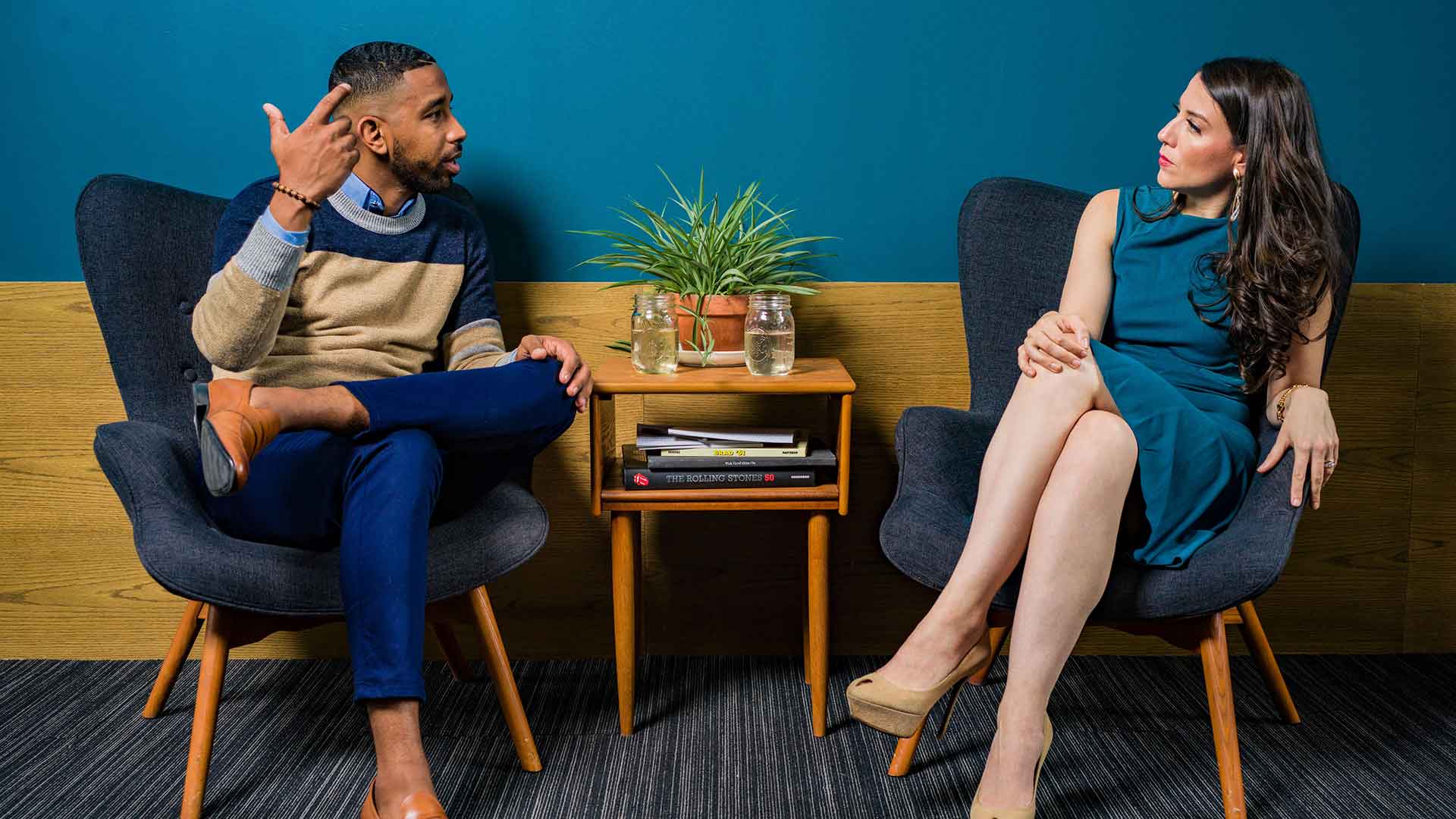 A CodeXpress consultant discussing an IT project with a client in a meeting lounge