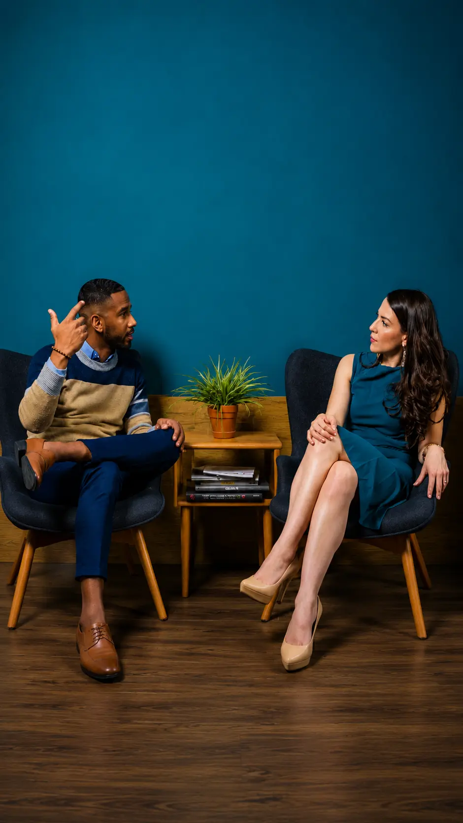A CodeXpress consultant discussing an IT project with a client in a meeting lounge